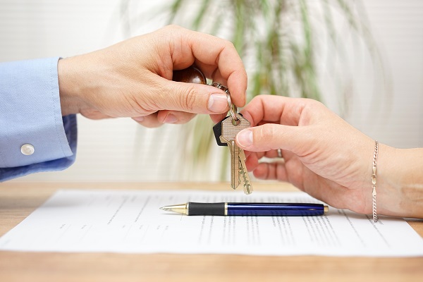 real estate agent handing over keys