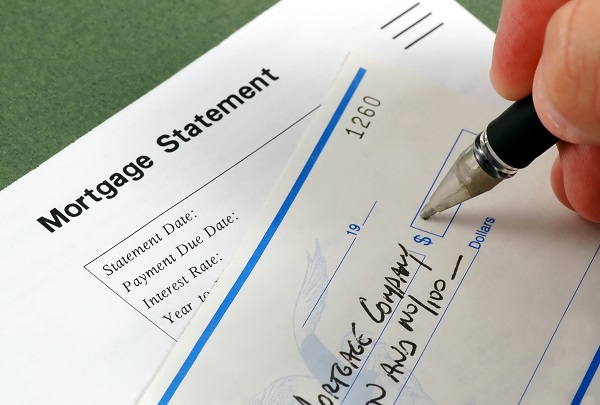 writing check for mortgage payment