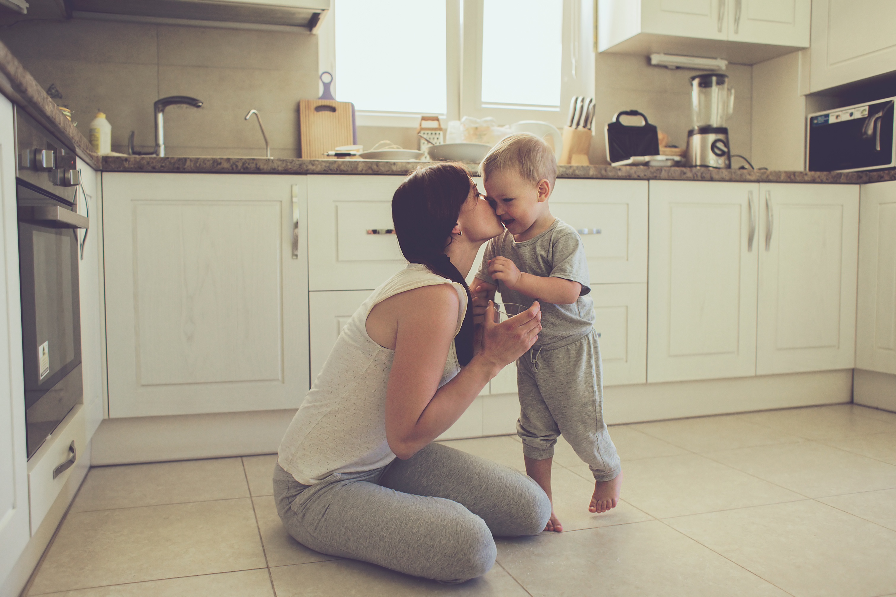 mom with toddler in kitchen