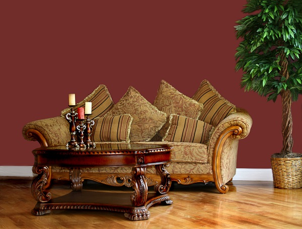 Brown couch in living room with red walls