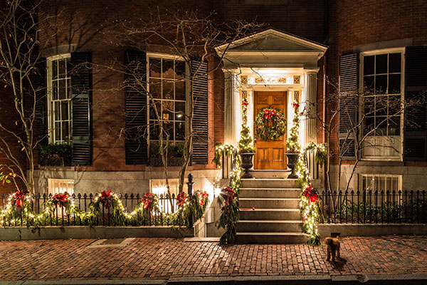 Front door of house with holiday lights