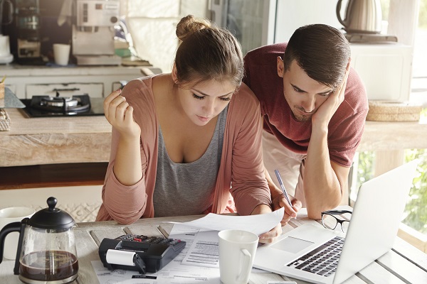 Young couple reviewing finances