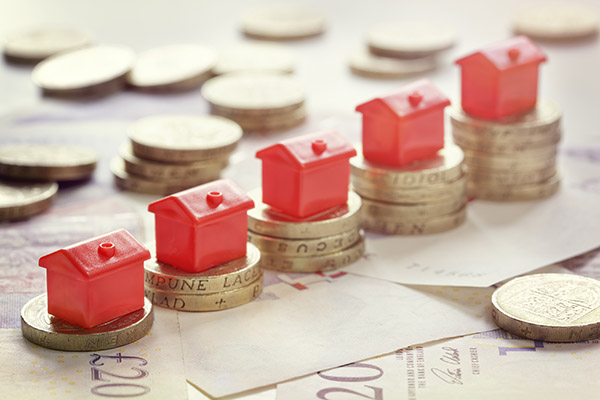 houses on stacks of coins