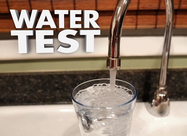 water coming out of faucet with words water test