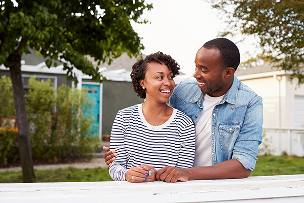 couple outside of new house